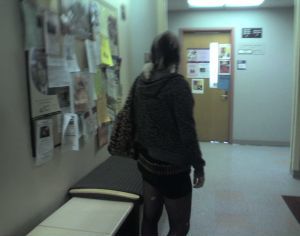 A student with a rat on her shoulder